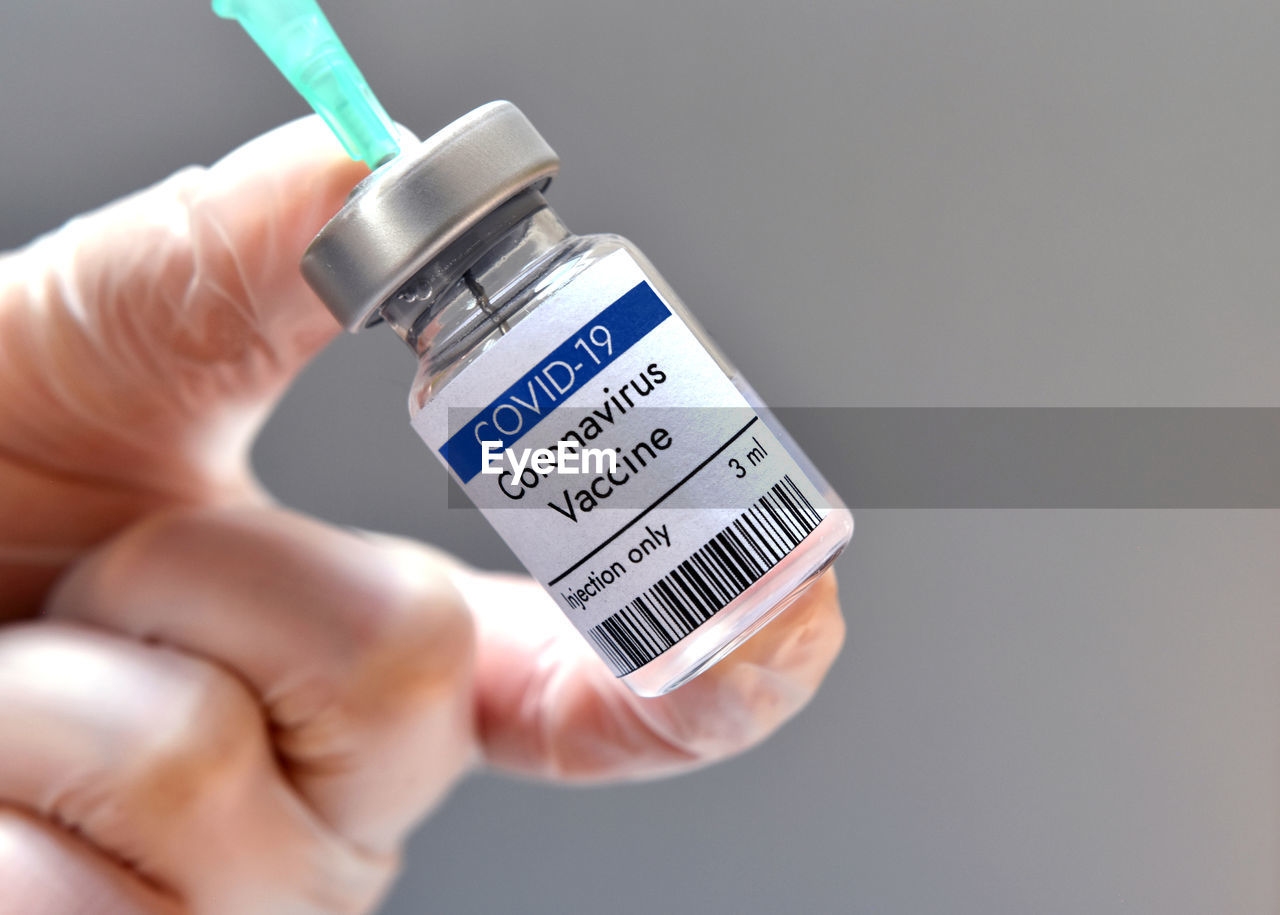 Coronavirus vaccine vial bottle in research laboratory. close-up view