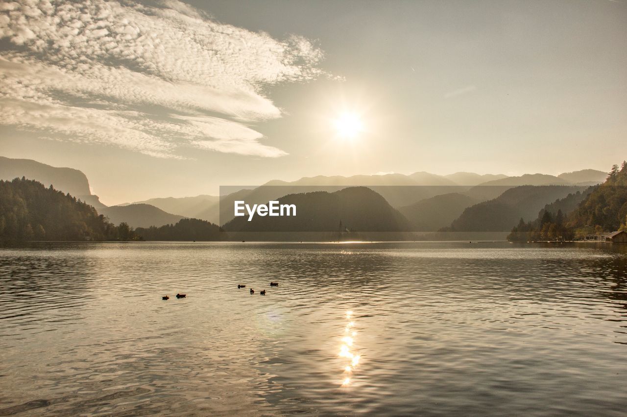 Scenic view of lake against sky during sunset