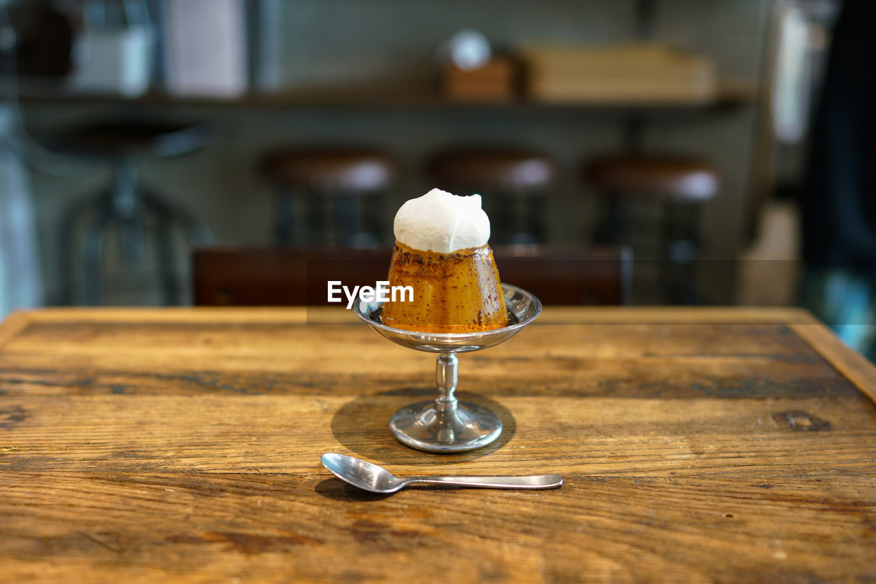 CLOSE-UP OF COFFEE ON TABLE IN CAFE