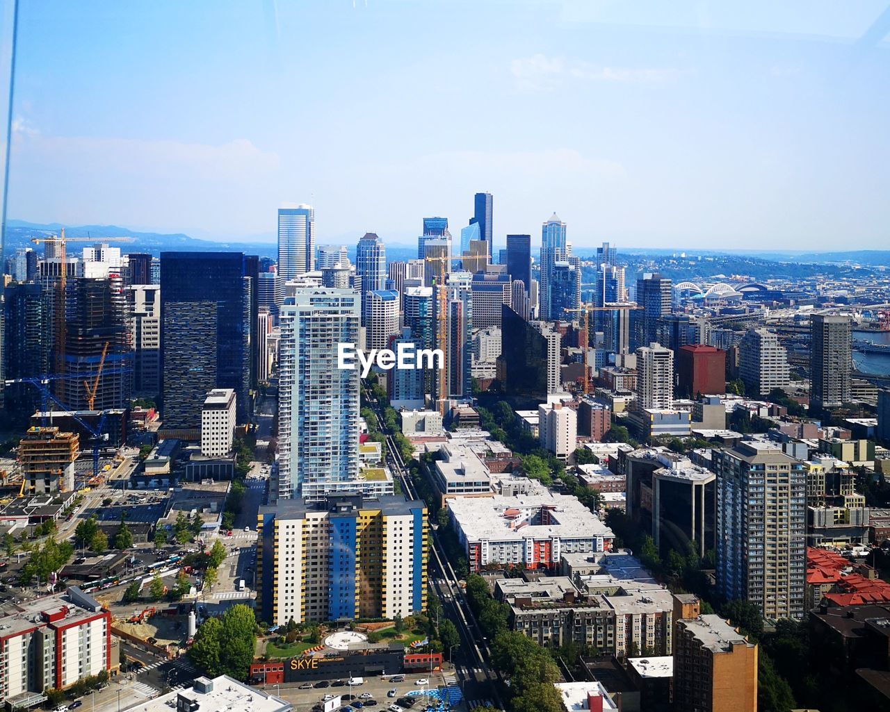 HIGH ANGLE VIEW OF MODERN BUILDINGS AGAINST SKY