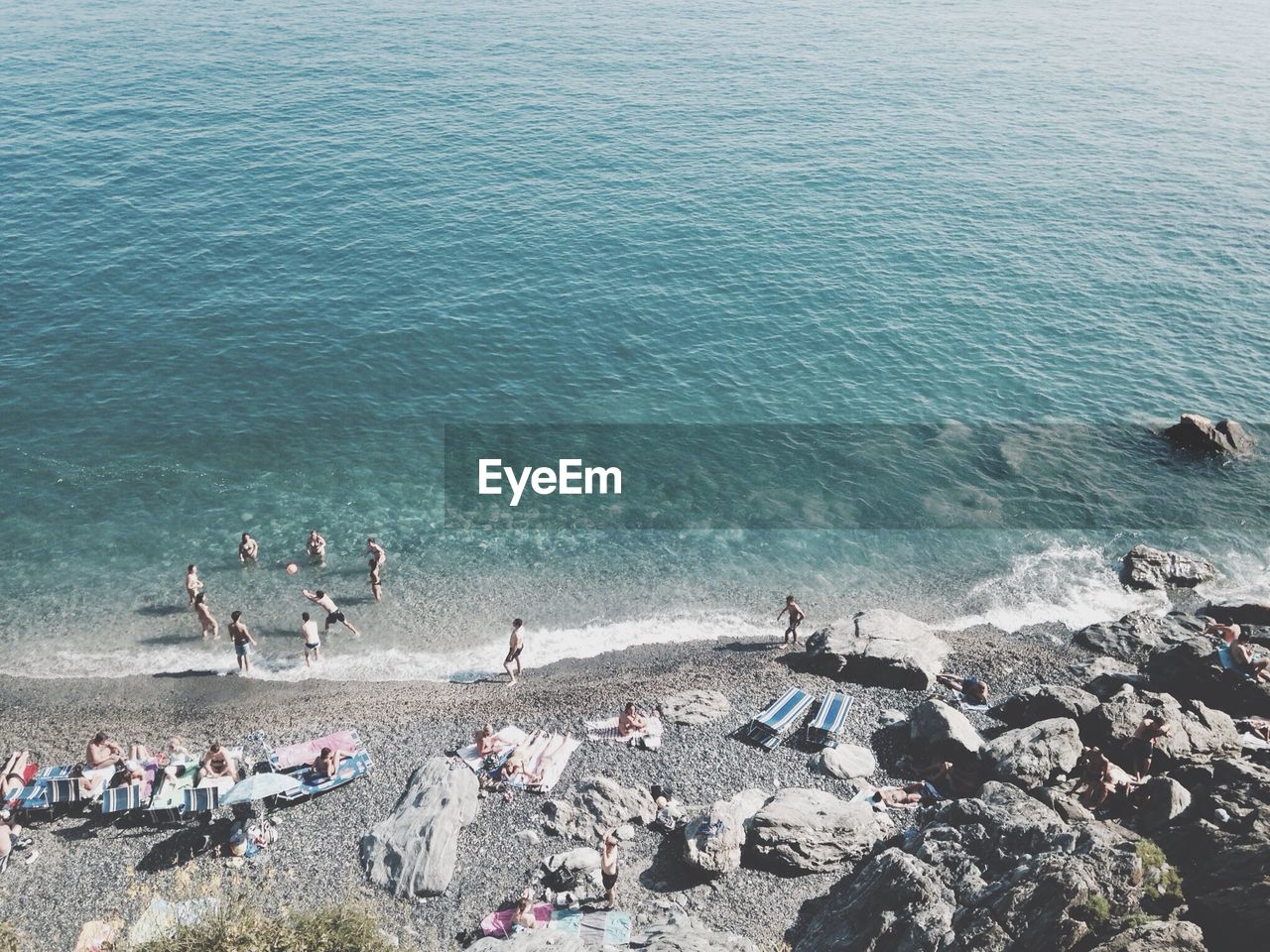 High angle view of people enjoying beach vacation