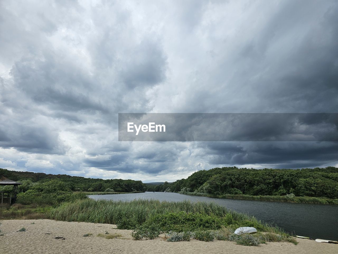 cloud, sky, environment, nature, landscape, beauty in nature, land, scenics - nature, horizon, sea, plant, water, no people, hill, storm, tree, coast, dramatic sky, overcast, outdoors, rural area, shore, grass, day, cloudscape, tranquility, travel, non-urban scene, beach, storm cloud, travel destinations