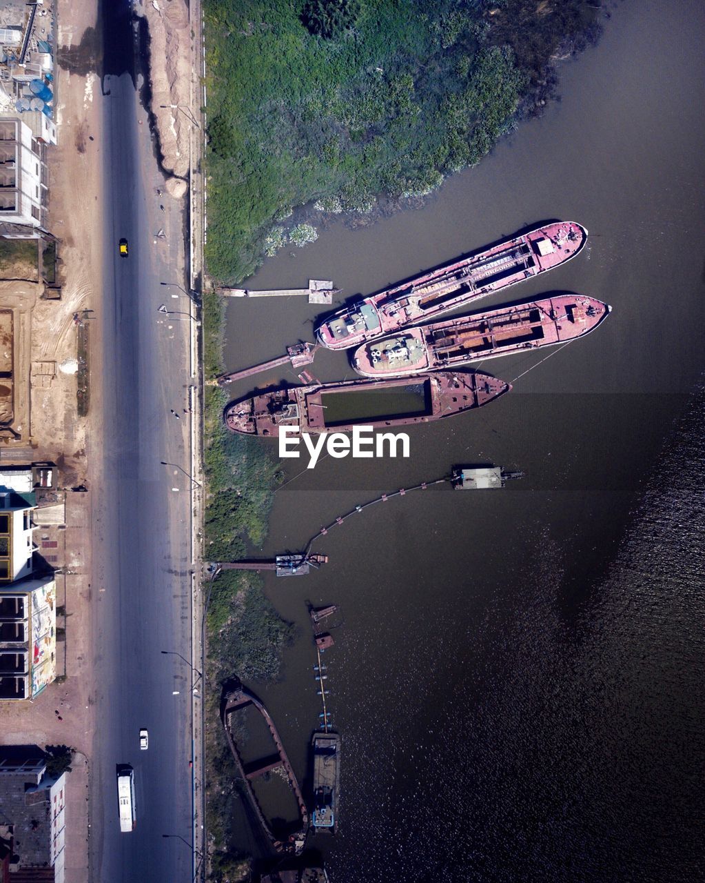 HIGH ANGLE VIEW OF SHIP MOORED ON RIVER