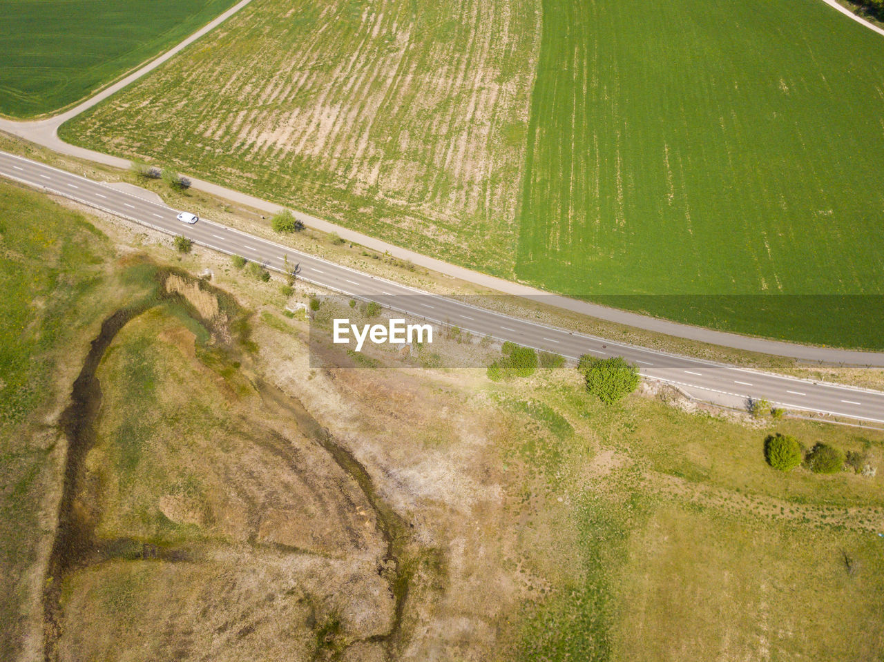 High angle view of road passing through land