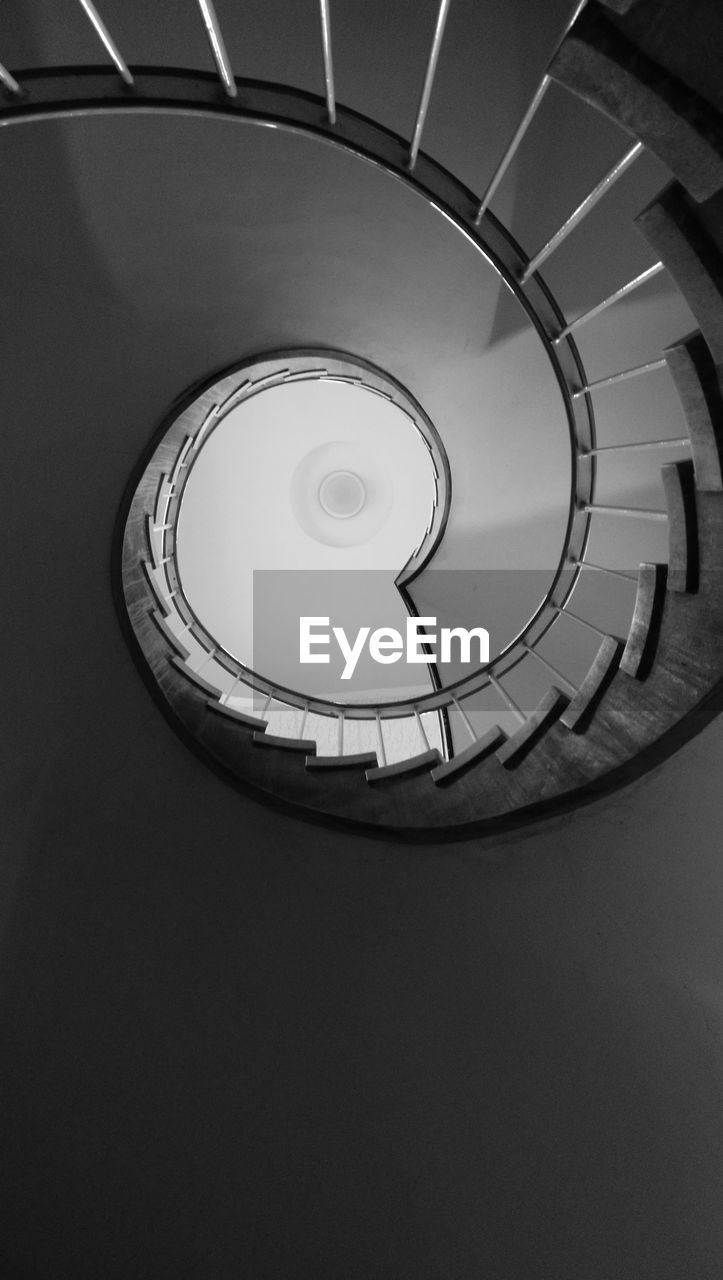 LOW ANGLE VIEW OF SPIRAL STAIRS