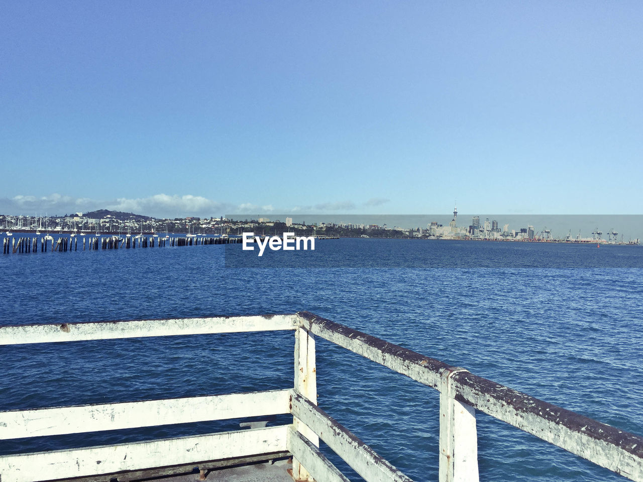 Scenic view of sea against clear blue sky