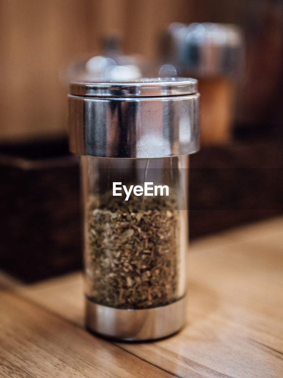 Close-up of pepper shaker on table
