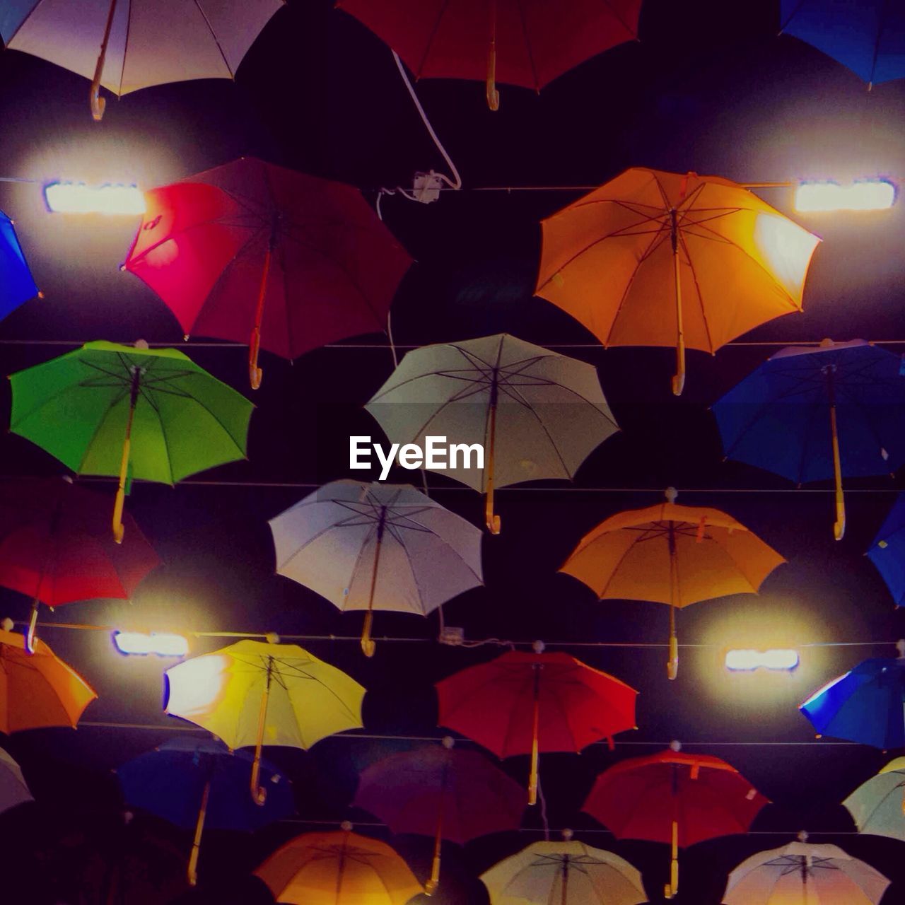 Multi-colored umbrellas decorating ceiling