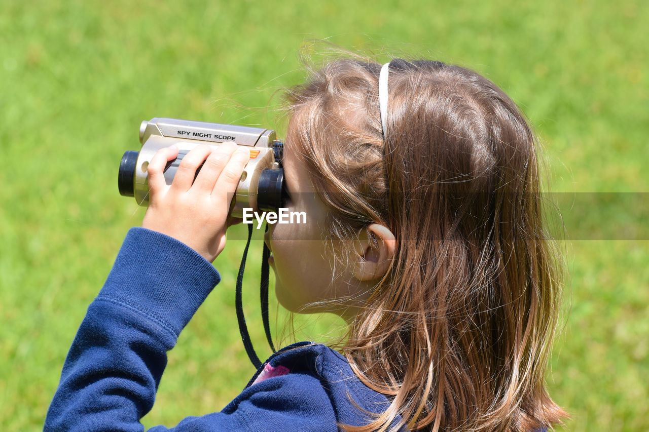 Portrait of girl with binoculars