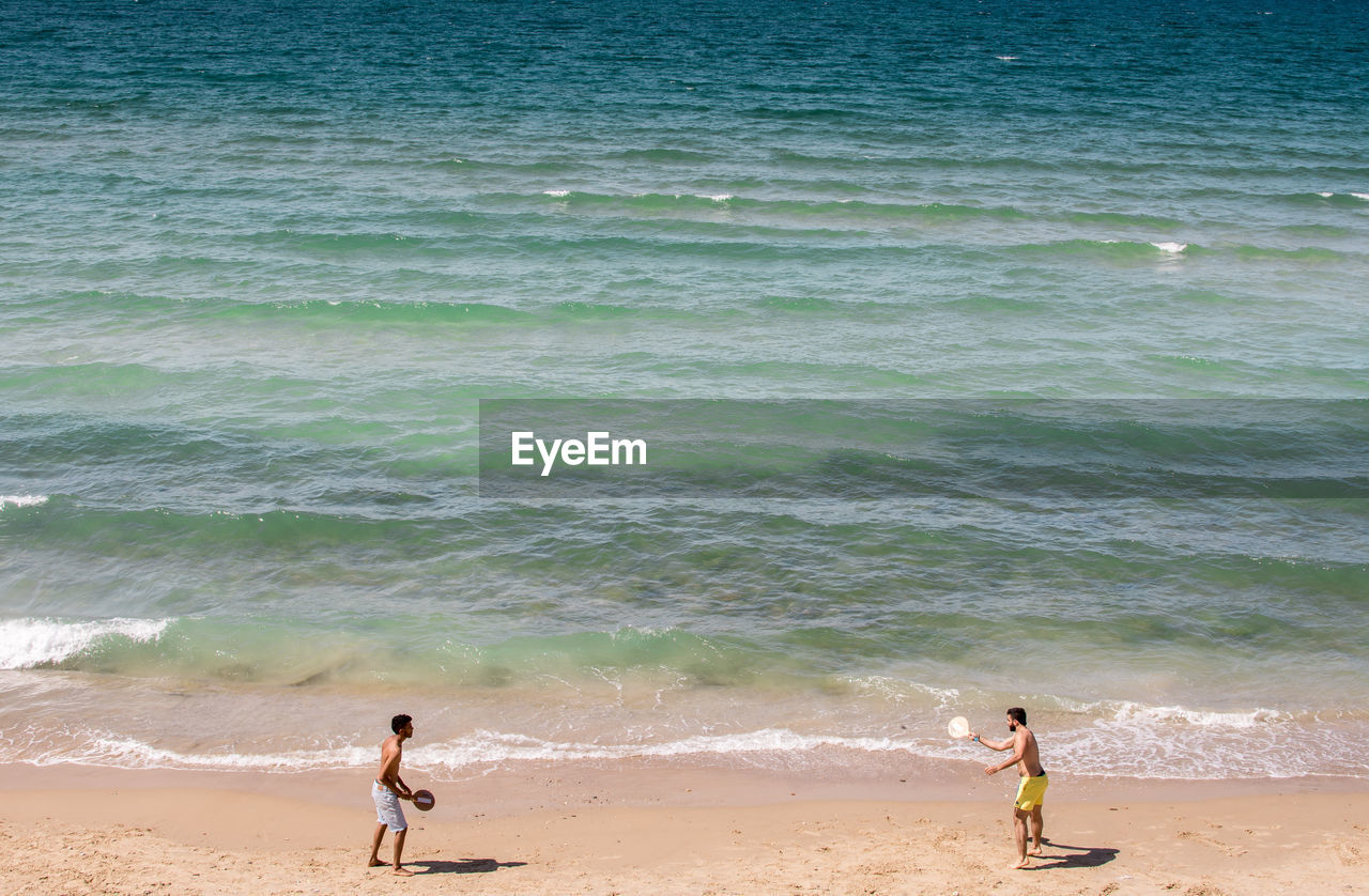 TOURISTS ON BEACH