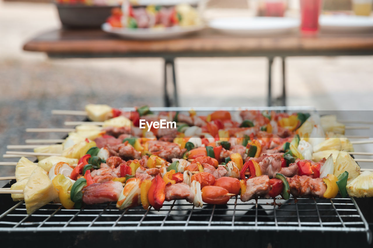 CLOSE-UP OF MEAT ON BARBECUE