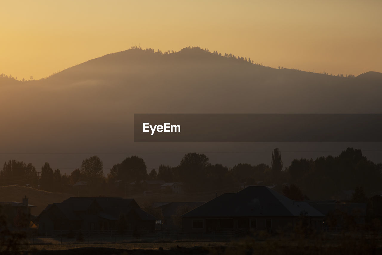 Mount dean stone sits above the missoula valley at sunrise