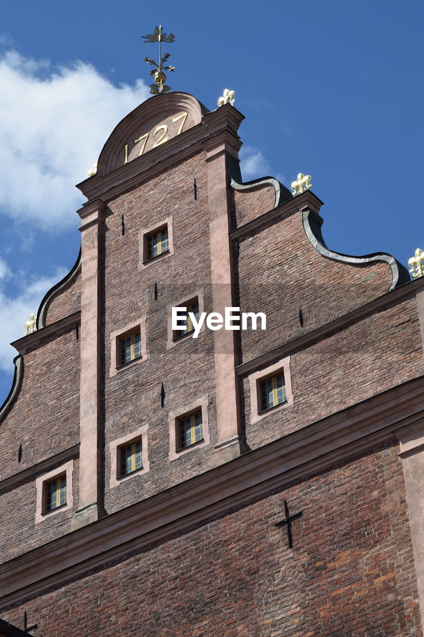 Low angle view of old building against sky