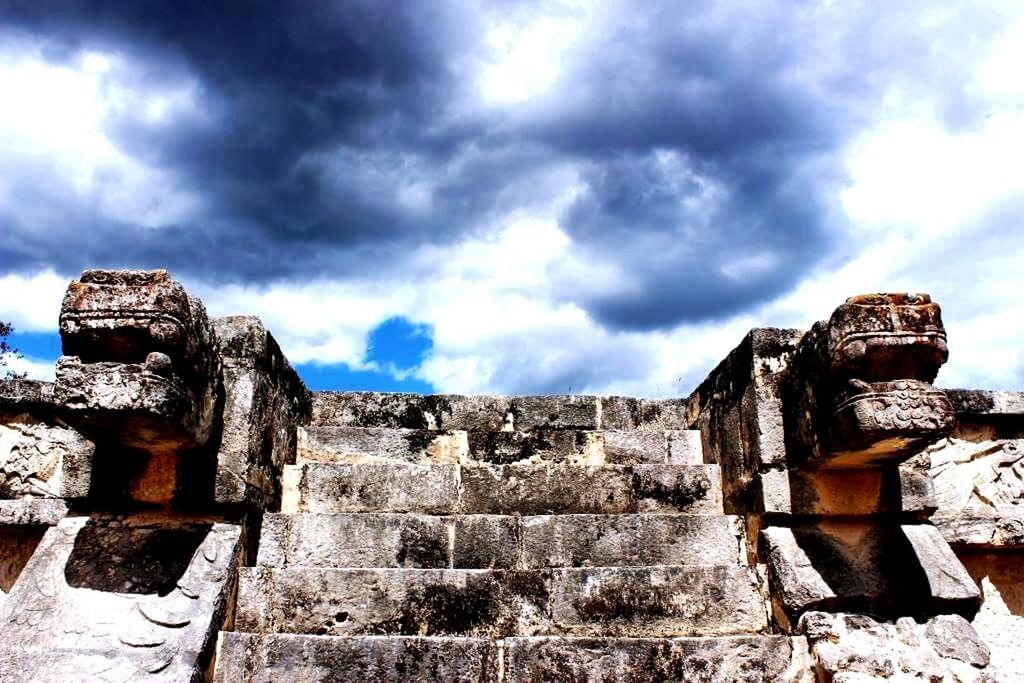 LOW ANGLE VIEW OF OLD RUINS AGAINST CLOUDY SKY