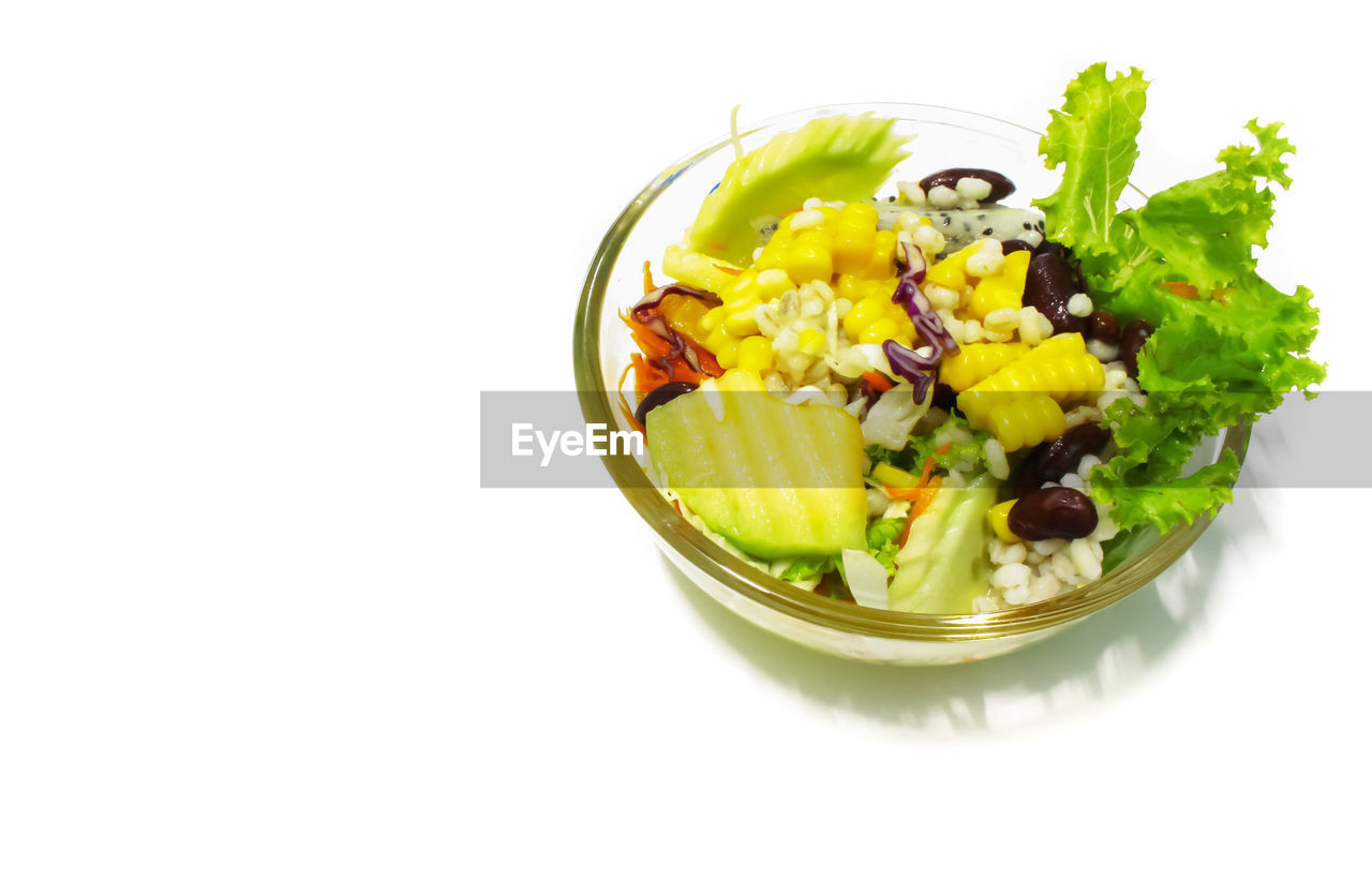 High angle view of salad in bowl over white background