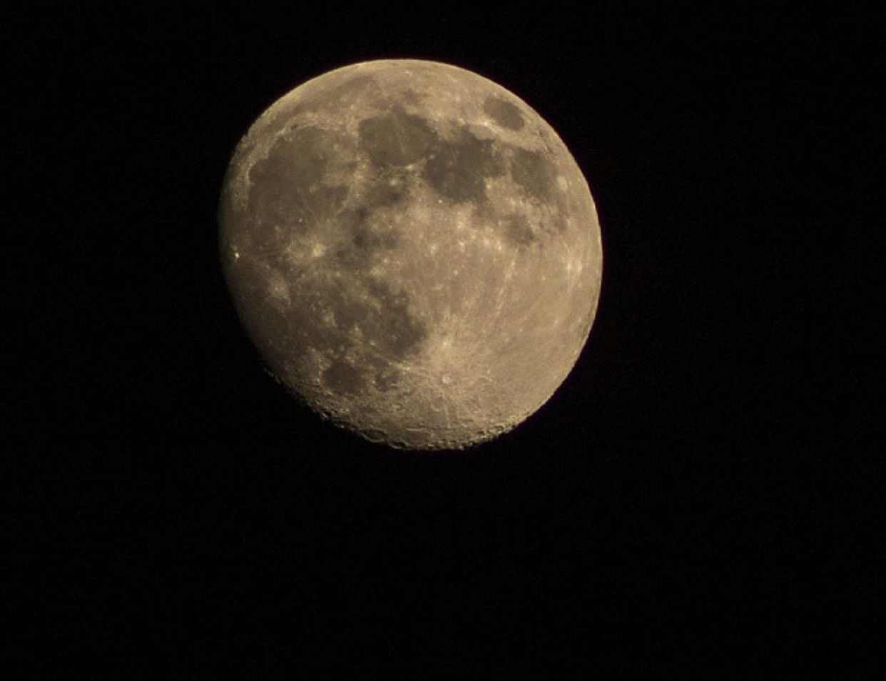 LOW ANGLE VIEW OF MOON OVER THE DARK