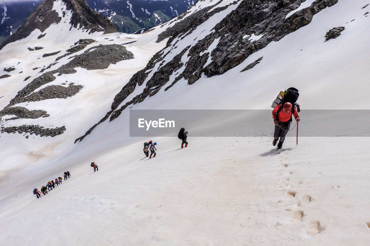 People skiing on snowcapped mountain