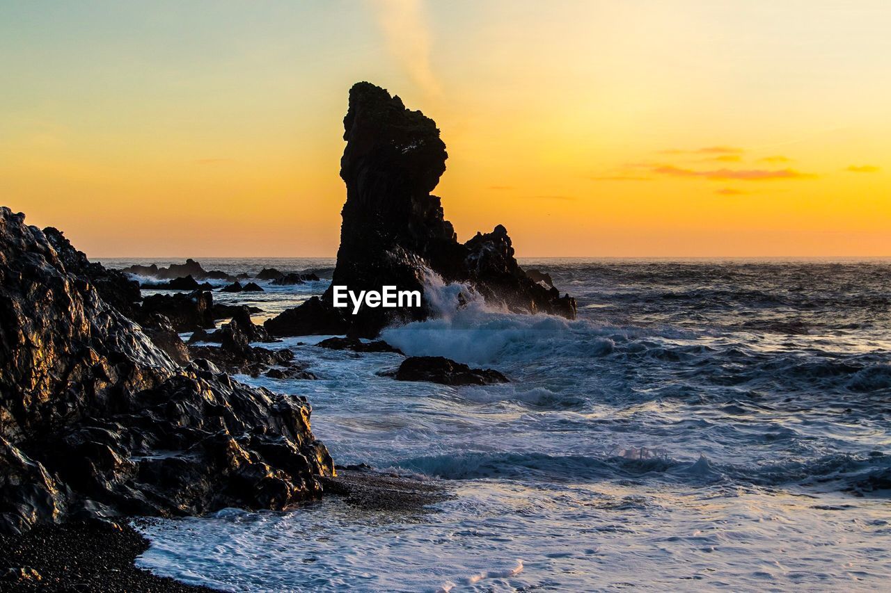 Scenic view of sea against sky during sunset