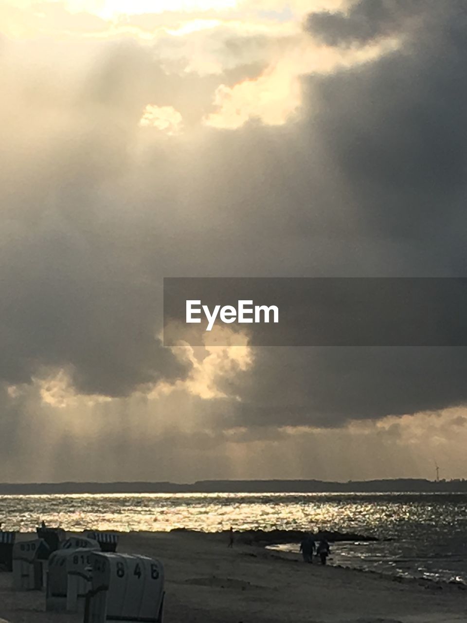 SCENIC VIEW OF BEACH AGAINST SKY AT SUNSET