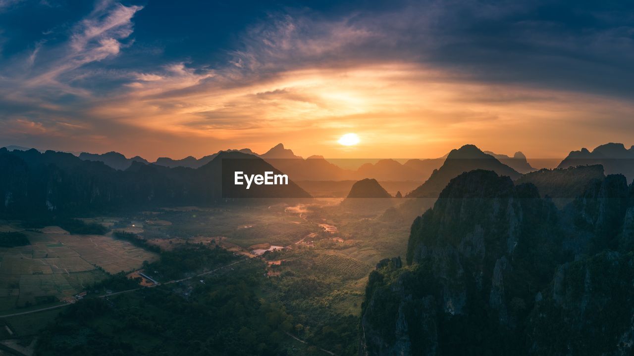 Scenic view of mountains against sky during sunset