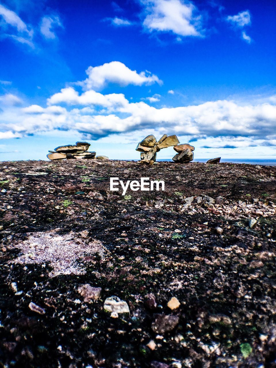 Scenic view of landscape against blue sky