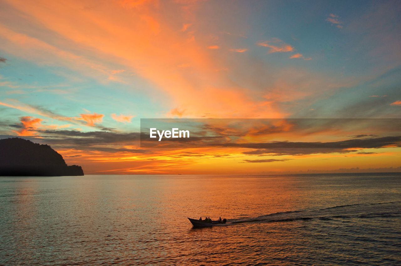 SCENIC VIEW OF SEA DURING SUNSET