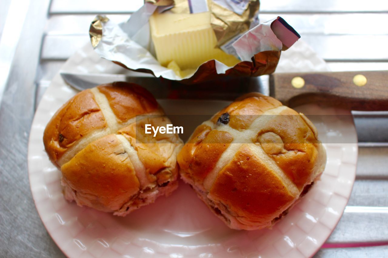 High angle view of hot cross buns in plate on table