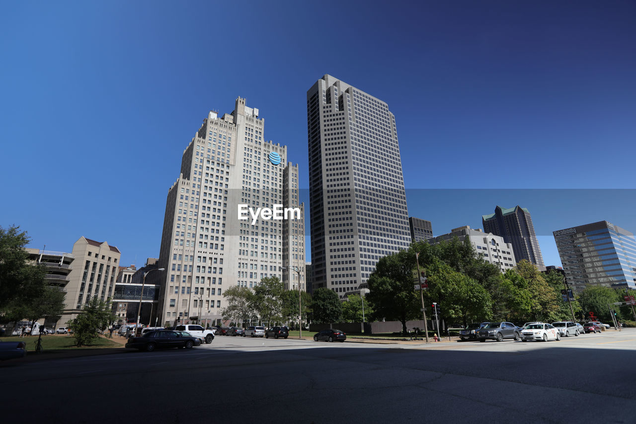 MODERN BUILDINGS AGAINST BLUE SKY IN CITY AGAINST CLEAR WEATHER