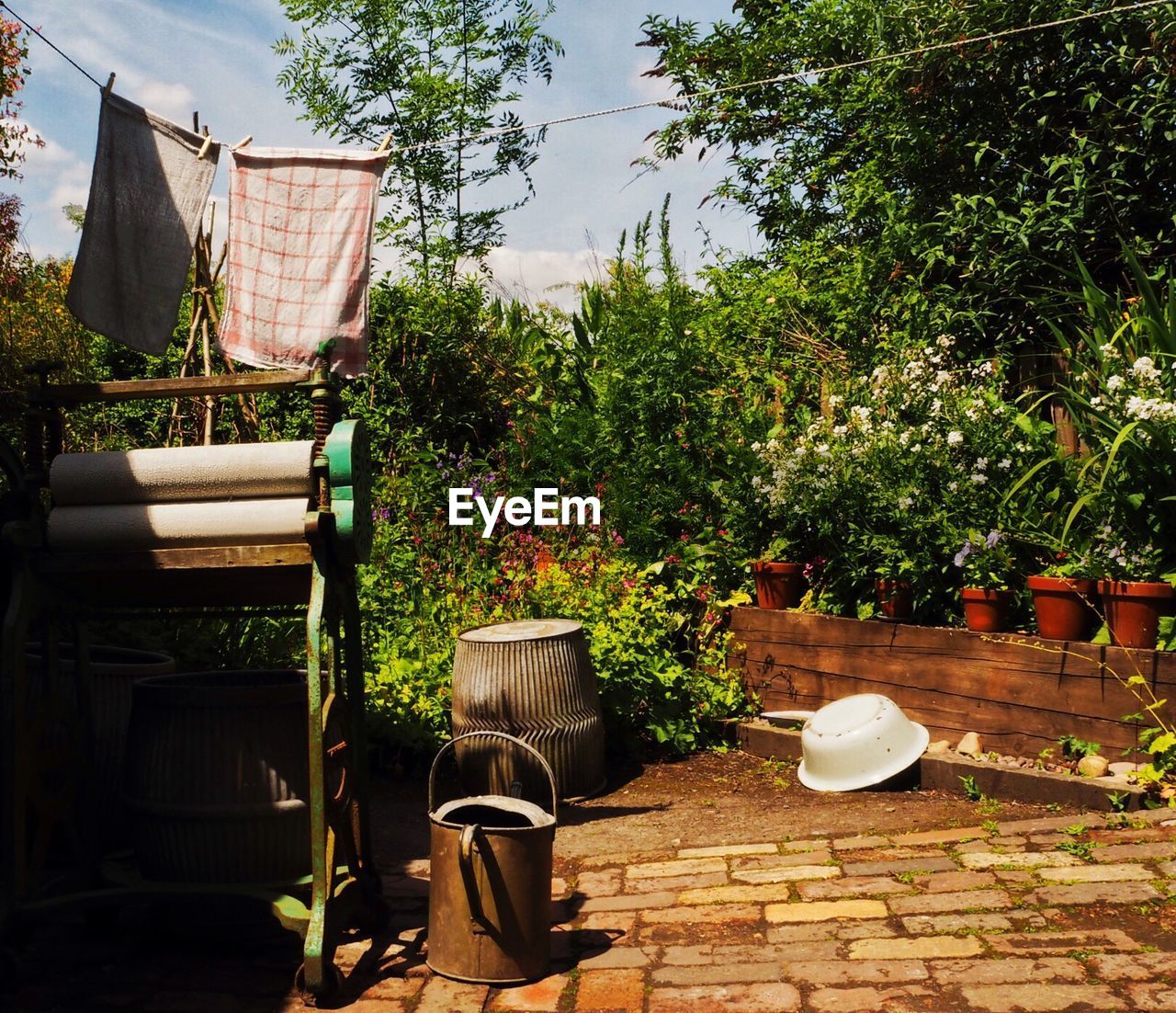 Clothesline hanging in yard against sky