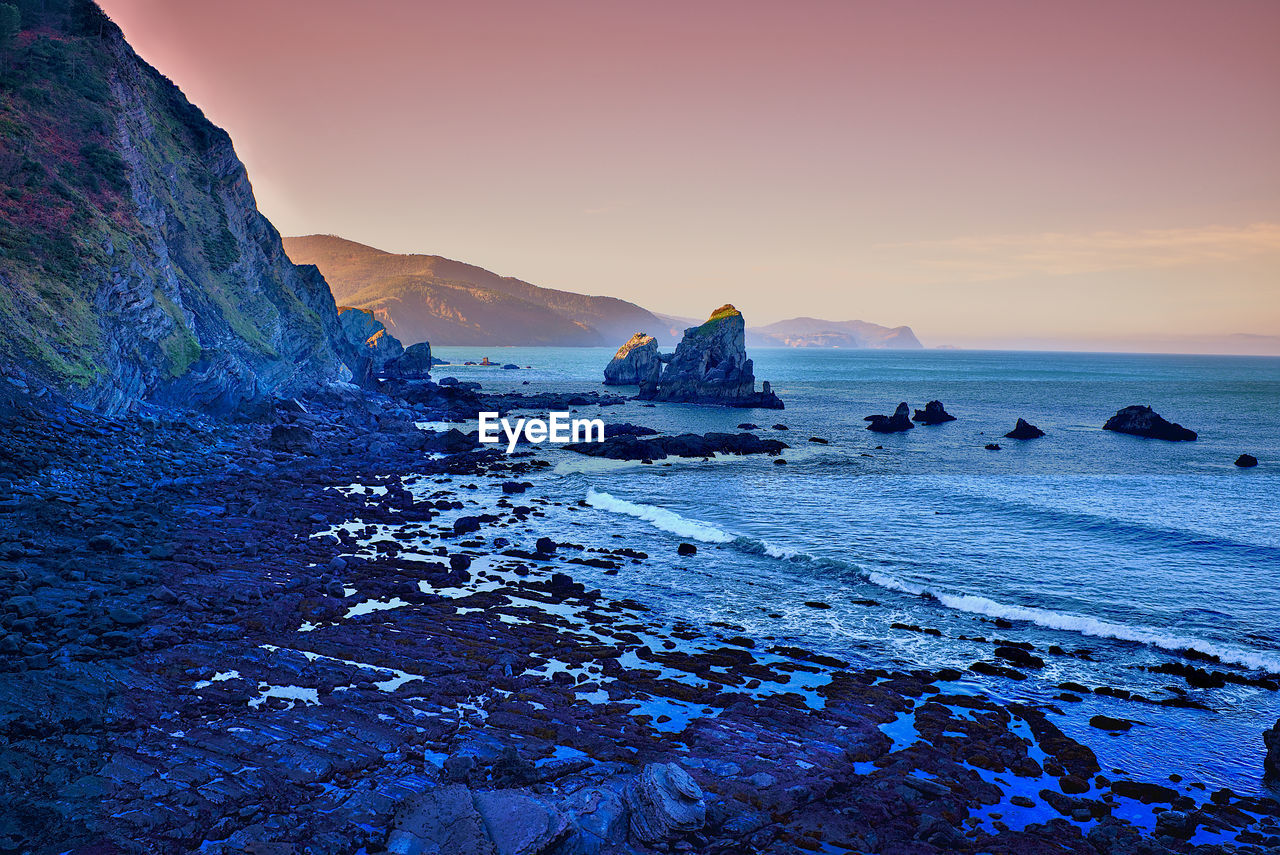 Scenic view of sea against sky during sunset