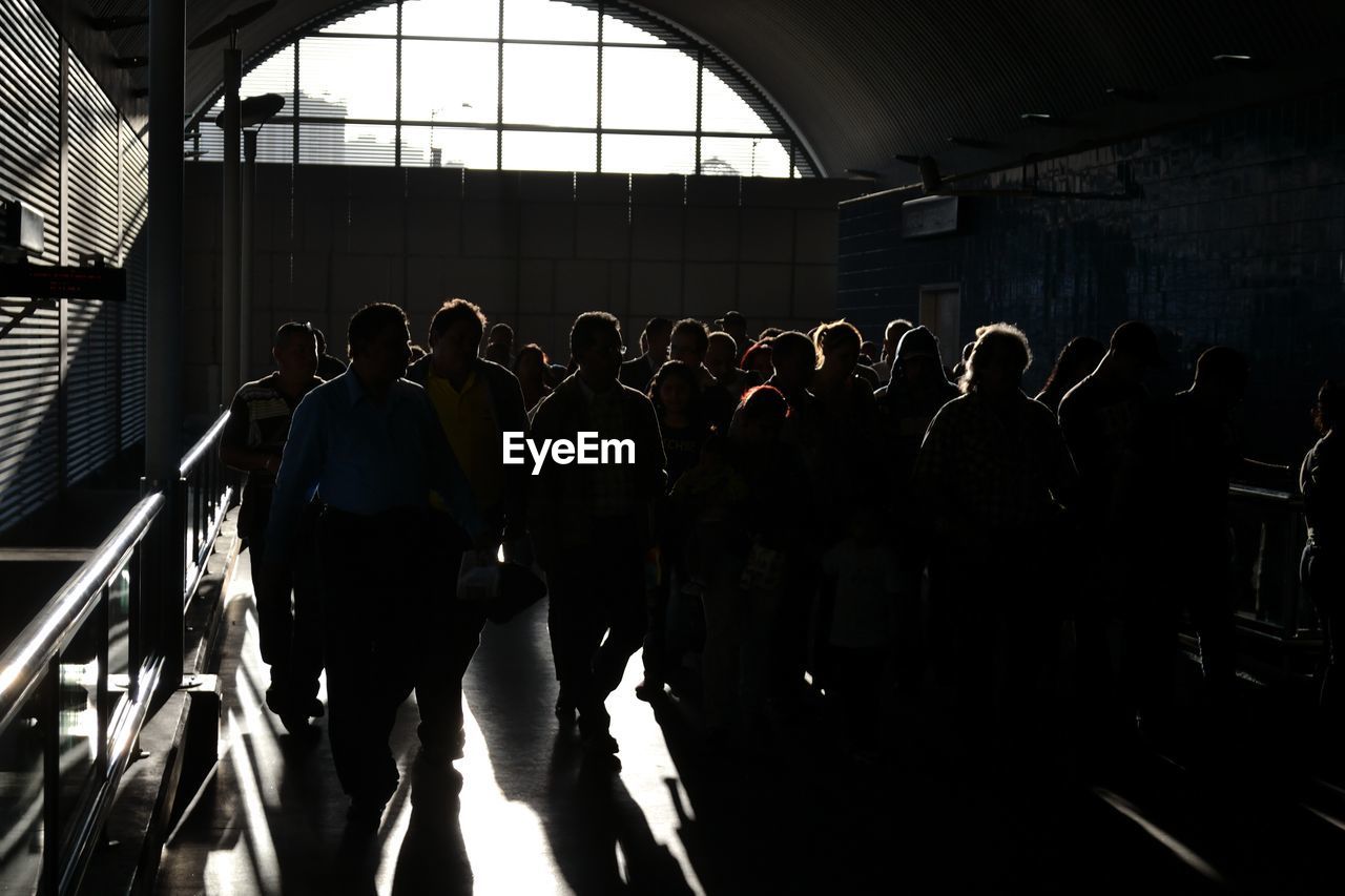 PEOPLE WALKING IN SUBWAY STATION