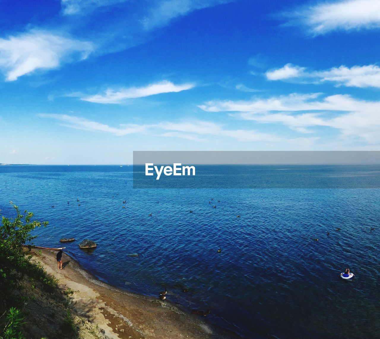 High angle view of sea against blue sky