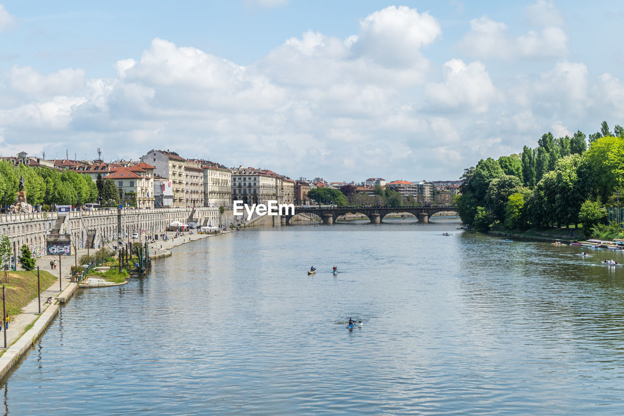 The murazzi on the river po in turin with the buildings reflected in the water