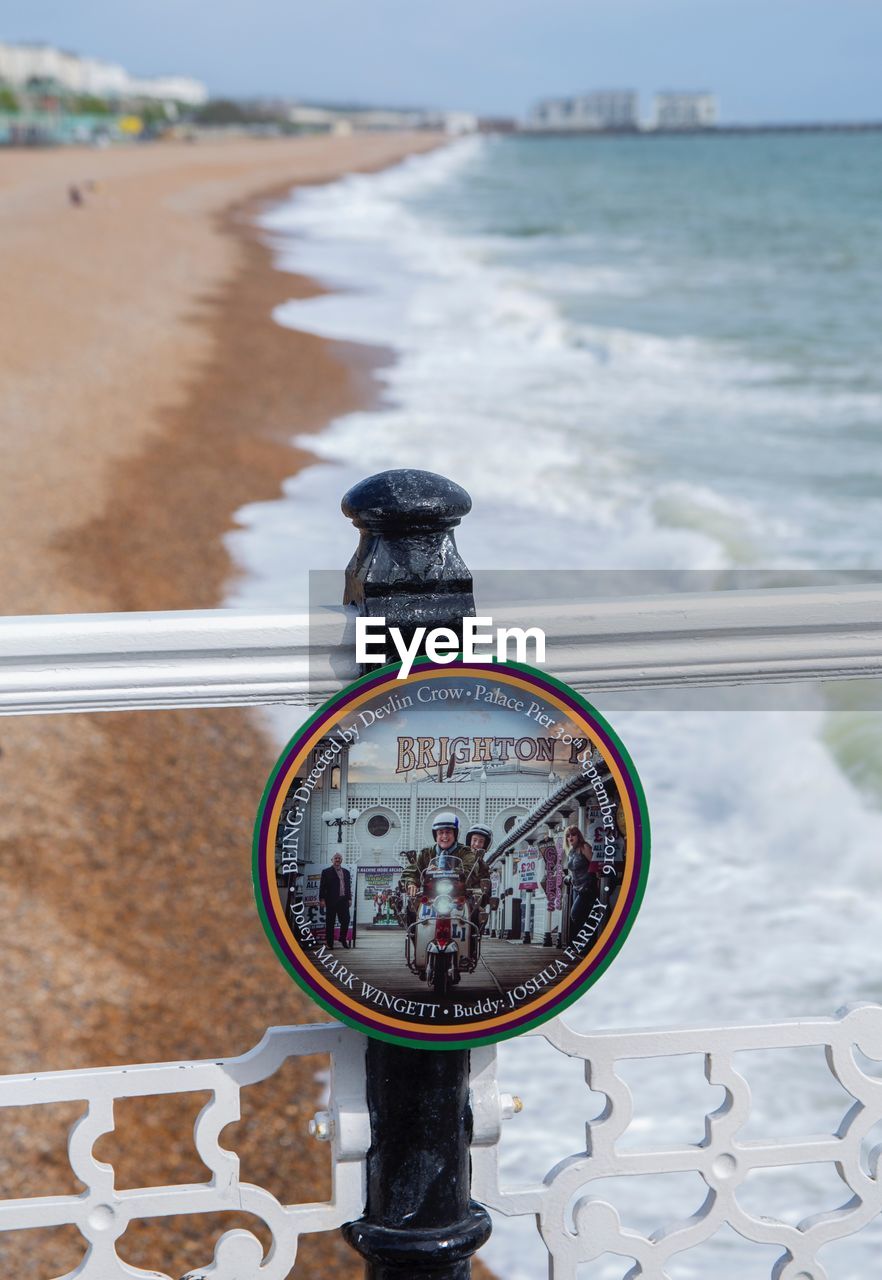 CLOSE-UP OF COIN-OPERATED BINOCULARS ON SEA