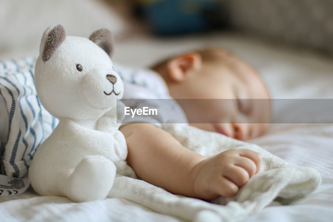 Cute baby sleeping on bed