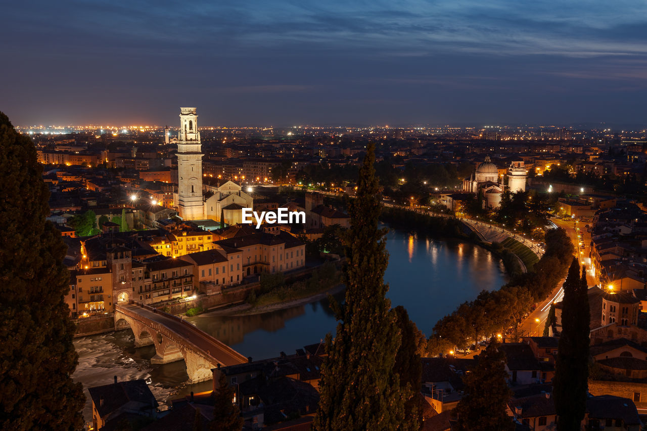 High angle view of illuminated city buildings at night
