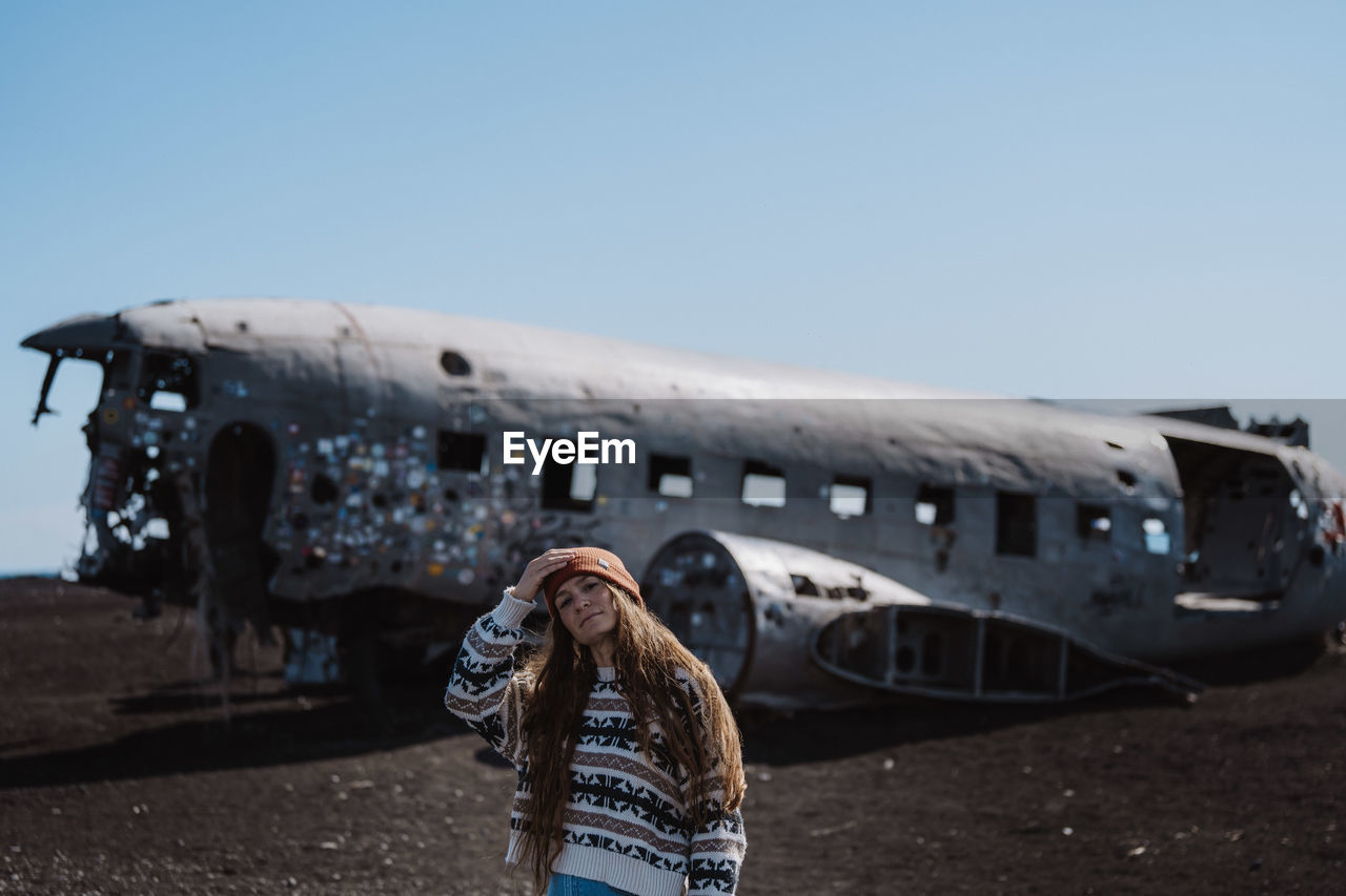 rear view of man standing in airplane