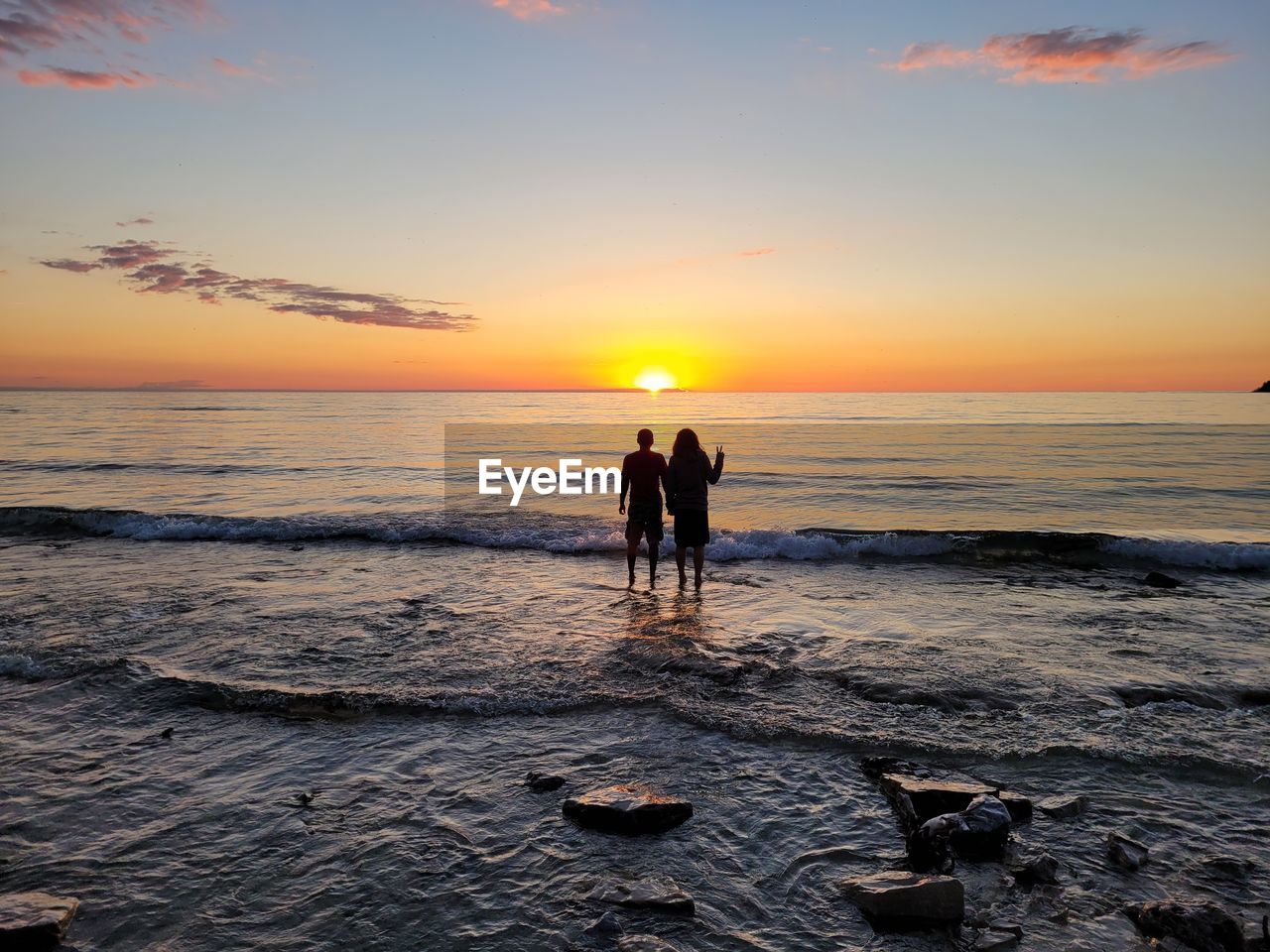 PEOPLE AT BEACH DURING SUNSET