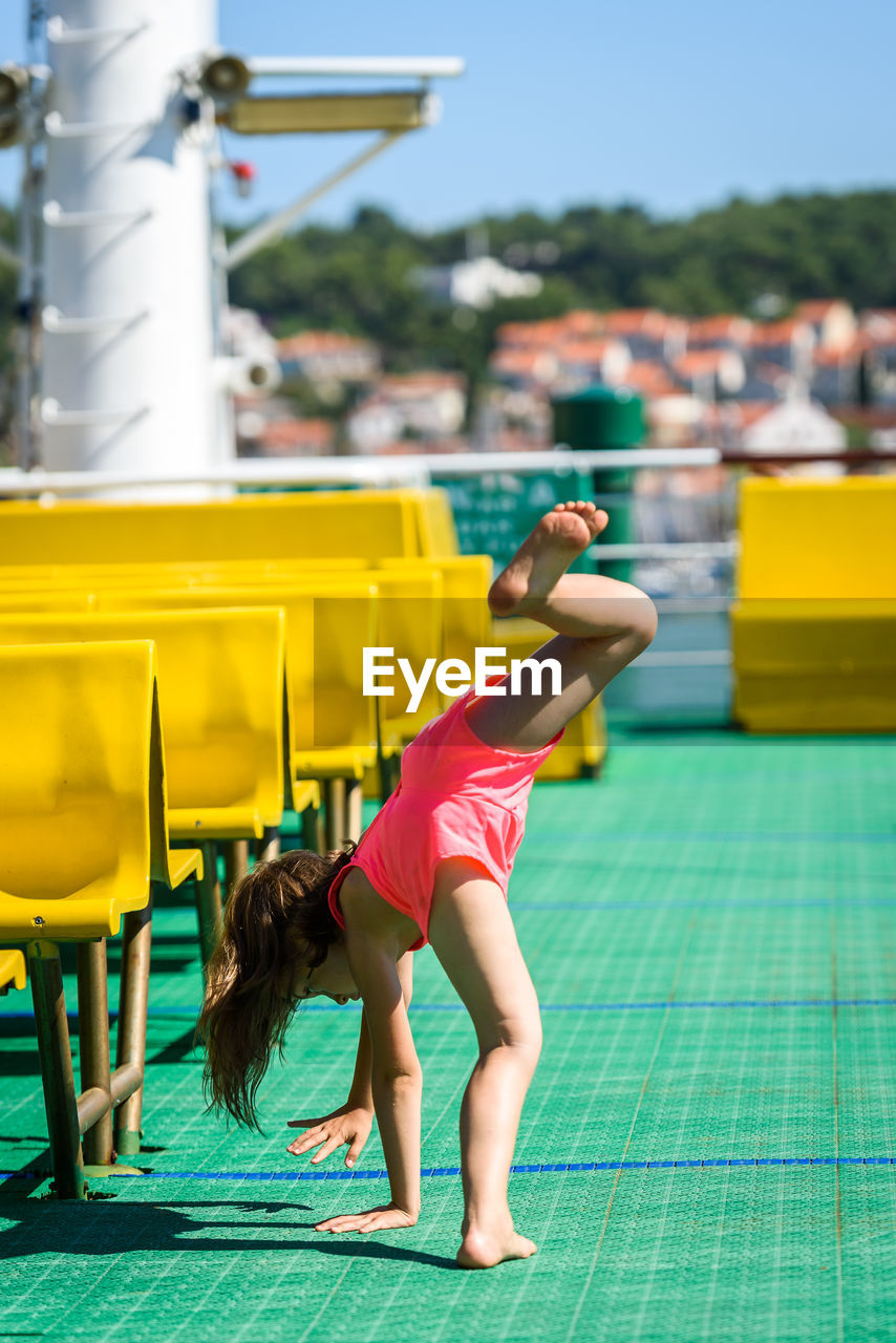 Girl doing stunt in boat