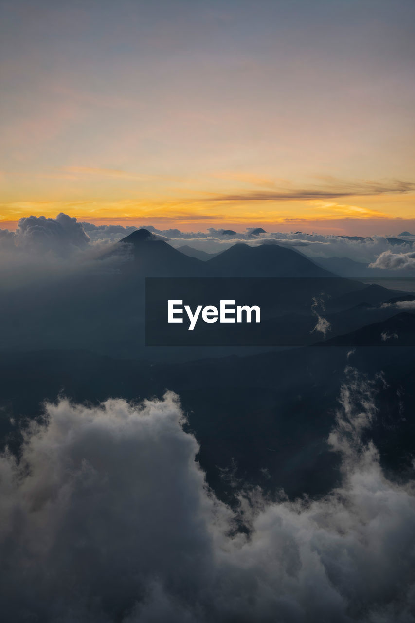 SCENIC VIEW OF CLOUDSCAPE AGAINST SKY AT SUNSET