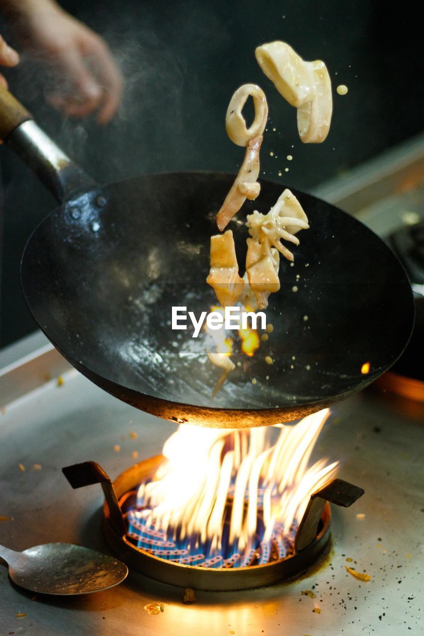 Close-up of burning wok pan