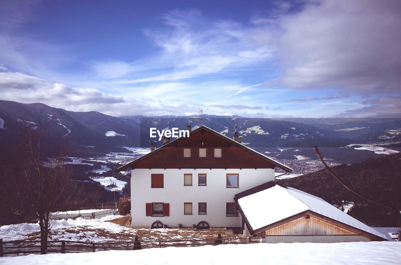 HOUSE AGAINST SKY DURING WINTER