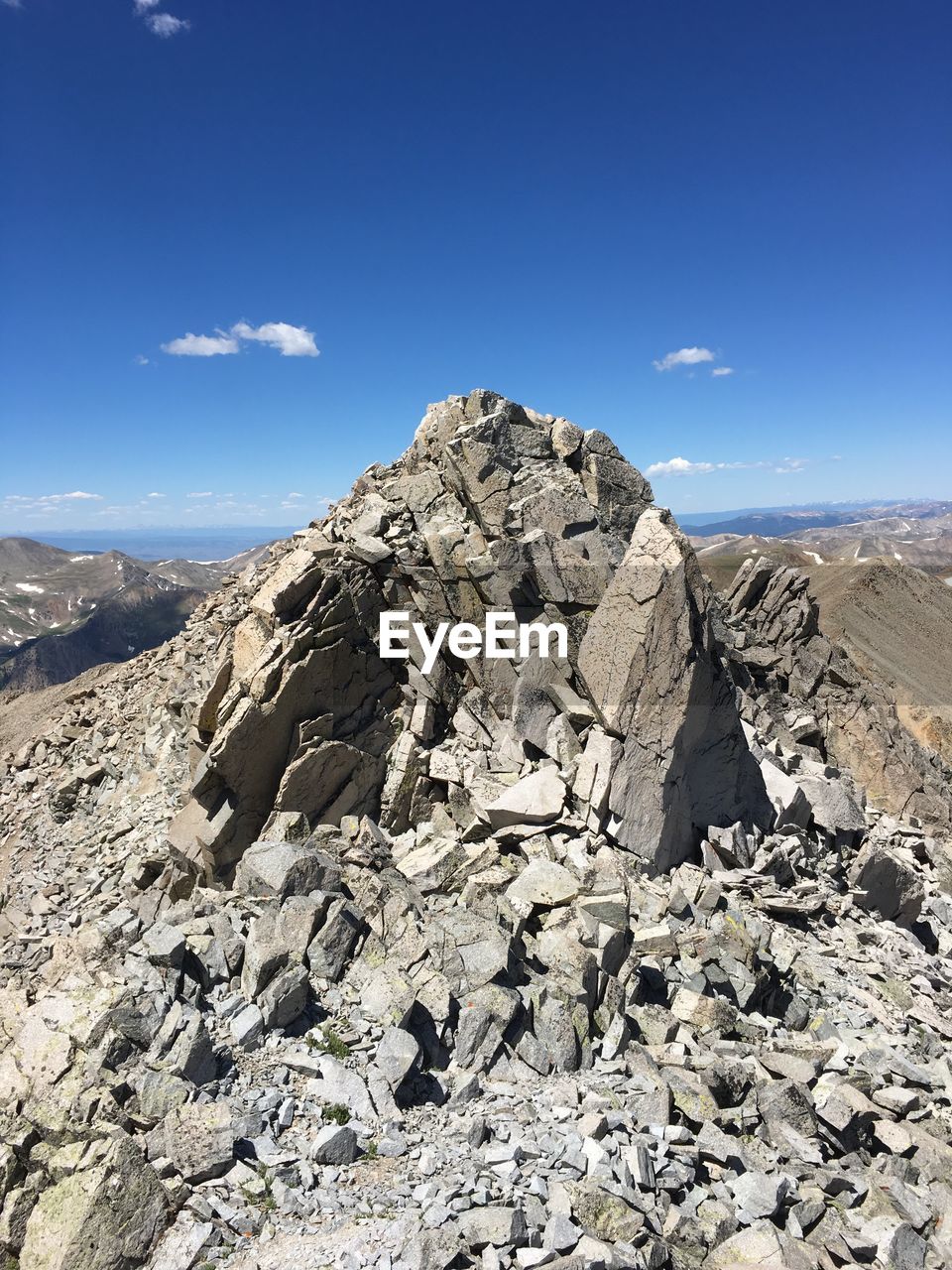 Rock formation against sky during sunny day