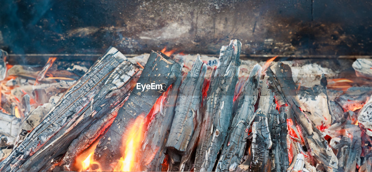 burning, fire, heat, flame, fireplace, no people, smoke, nature, barbecue grill, barbecue, glowing, food, wood, food and drink, outdoors, log, burnt, bonfire, coal, metal, day, campfire, meat, camping, firewood, high angle view, ash