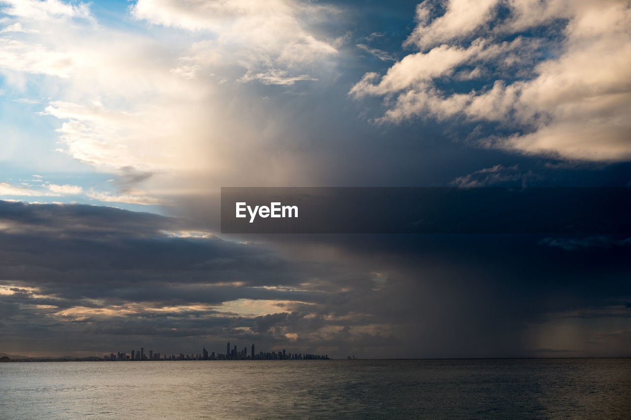 Scenic view of sea against dramatic sky