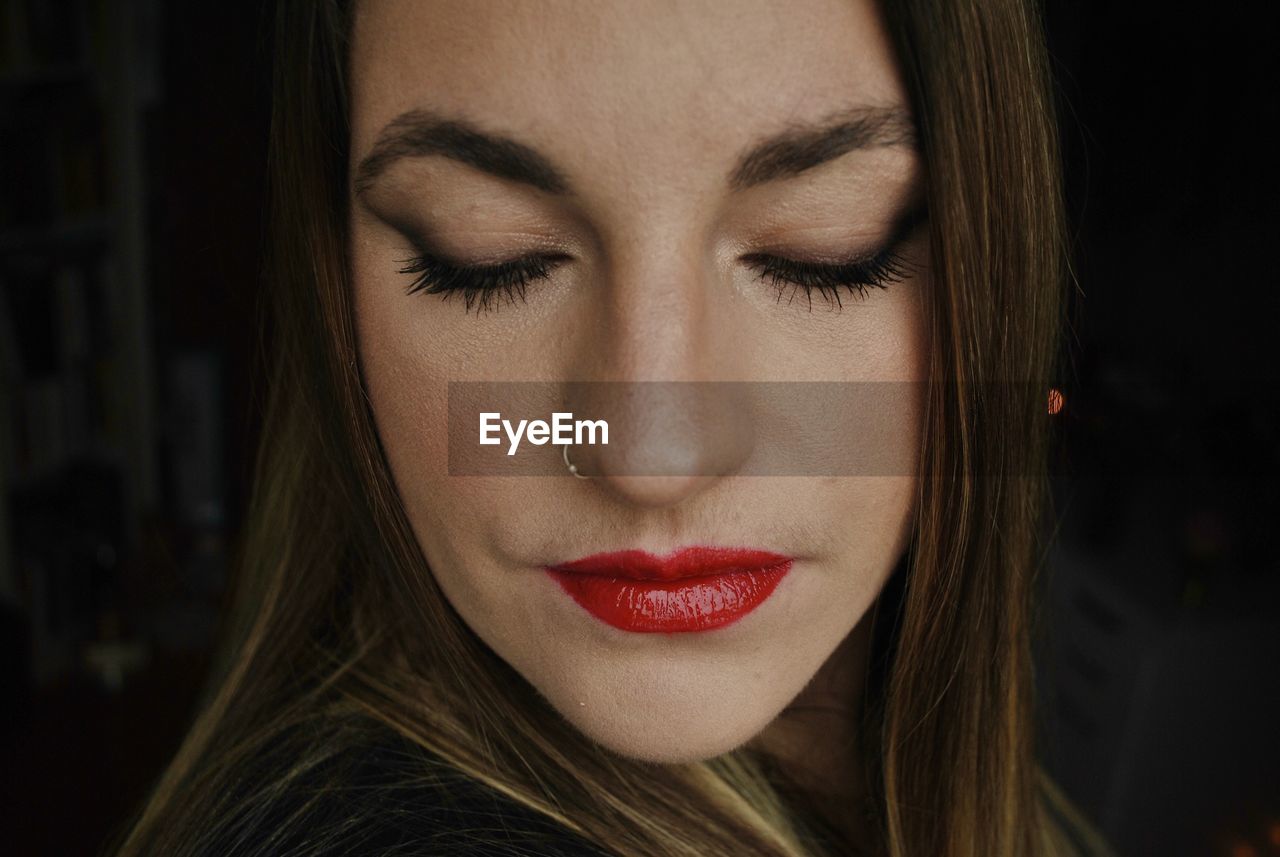 Close-up of beautiful young woman with make-up