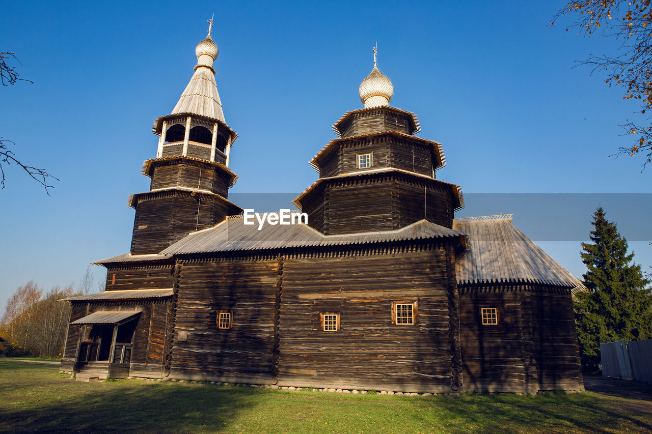 Old log church in russia in autumn