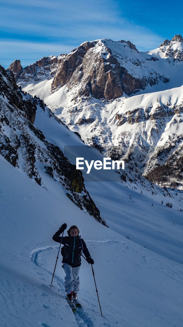 Girl skiing on snowcapped mountain