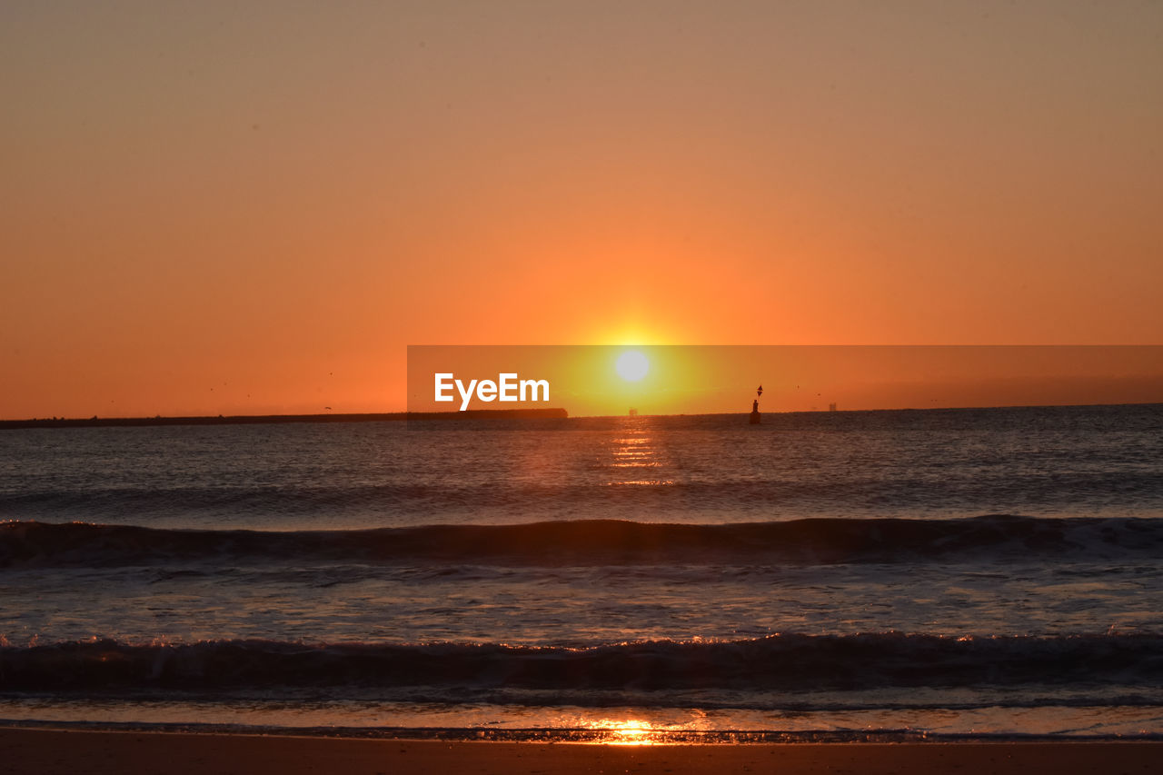 Scenic view of sunset over sea