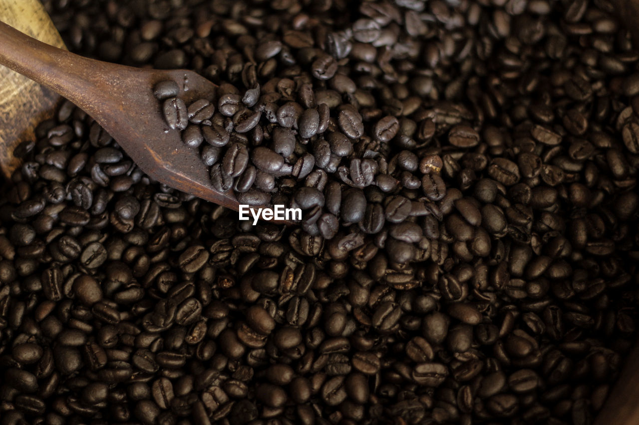 HIGH ANGLE VIEW OF COFFEE BEANS IN BACKGROUND